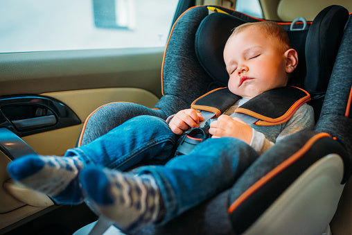 Sleeping child in a car seat